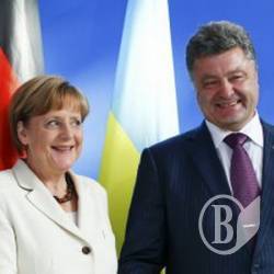 Порошенко при Меркель закликав Путіна припинити вогонь Порошенко при Меркель закликав Путіна припинити вогонь